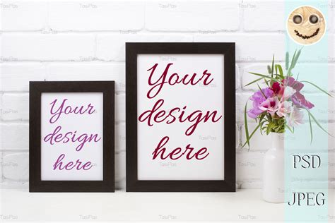 Download Two black brown poster frame mockup with pink clarkia flowers.